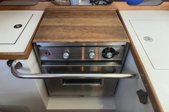 Slide: The Image of Interior of 1993 Catalina 36 MkII sailboat with cozy seating and wooden finishes. - 11