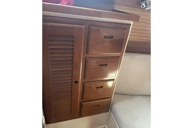 Slide: The Image of Interior cabin of a 1993 Catalina 36 MkII sailboat with striped cushions. - 15