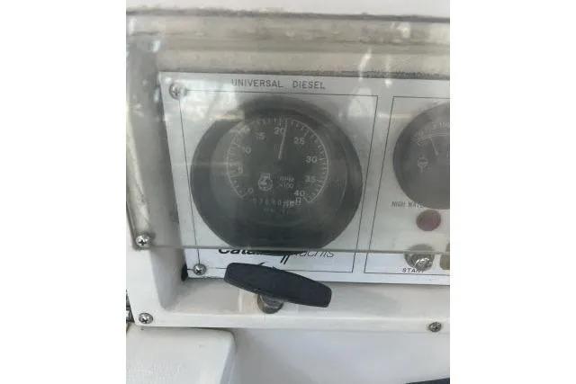 Slide: The Image of Cockpit view of a 1993 Catalina 36 MkII sailboat docked at a marina. - 23