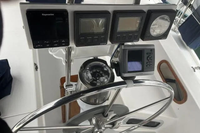 Slide: The Image of Cockpit of 1993 Catalina 36 MkII sailboat with navigation instruments and steering wheel. - 27