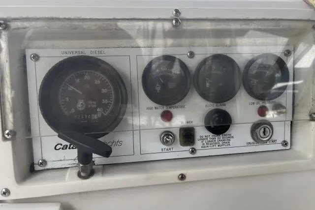 Slide: The Image of Control panel of a 1993 Catalina 36 MkII yacht with gauges and switches. - 28