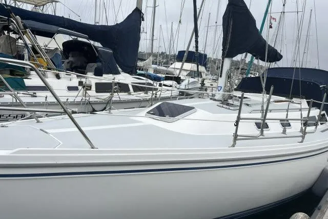 Slide: The Image of Catalina 36 MkII 1993 sailboat docked in a marina, surrounded by other boats. - 35