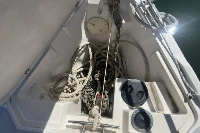 Slide: The Image of Anchor locker of 1993 Catalina 36 MkII sailboat with ropes and chains. - 36