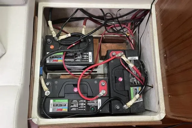 Slide: The Image of Battery compartment of a 1993 Catalina 36 MkII sailboat with connected wiring. - 38