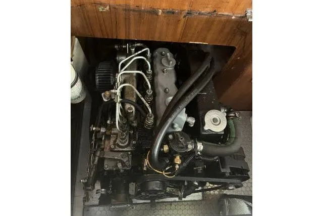 Slide: The Image of Engine compartment of a 1993 Catalina 36 MkII sailboat, showcasing mechanical components. - 39