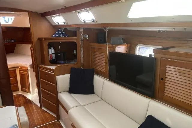 Slide: The Image of Interior of 1993 Catalina 36 MkII sailboat with cozy seating and wooden cabinetry. - 4