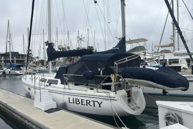 Slide: The Image of 1993 Catalina 36 MkII sailboat named Liberty docked at marina. - 42