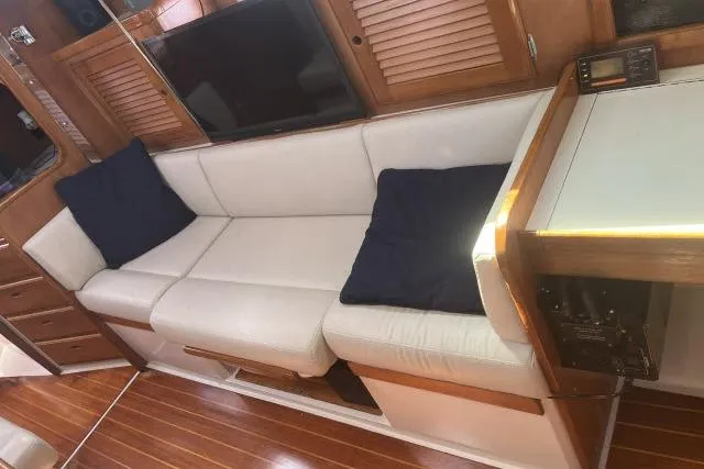 Slide: The Image of Interior of a 1993 Catalina 36 MkII sailboat with cozy seating and wooden cabinetry. - 5
