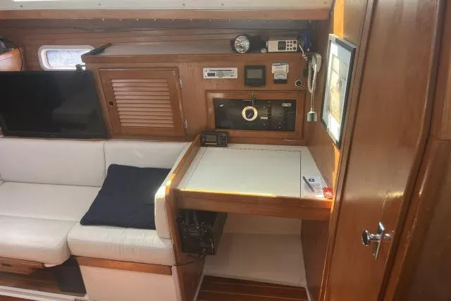 Slide: The Image of Interior of a 1993 Catalina 36 MkII sailboat with cozy seating and navigation station. - 6
