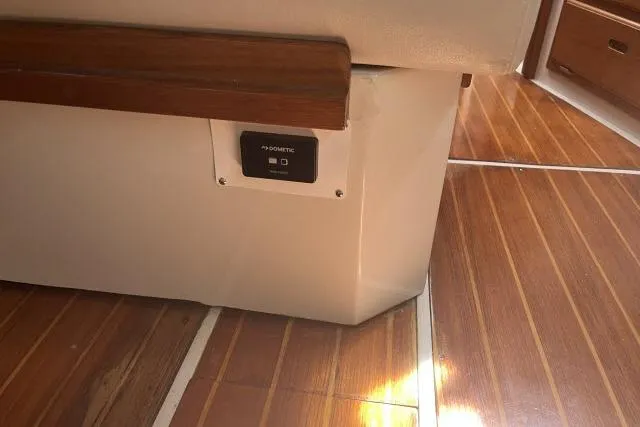 Slide: The Image of Interior of 1993 Catalina 36 MkII sailboat with polished wooden flooring and seating. - 9