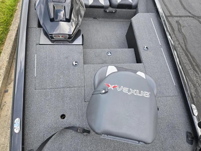 Slide: The Image of 2022 Vexus AVX181 boat interior with gray seating and carpeted flooring. - 18
