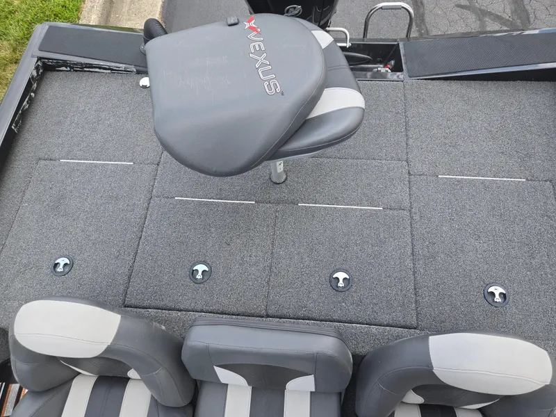 Slide: The Image of 2022 Vexus AVX181 boat interior with gray seating and carpeted deck. - 21