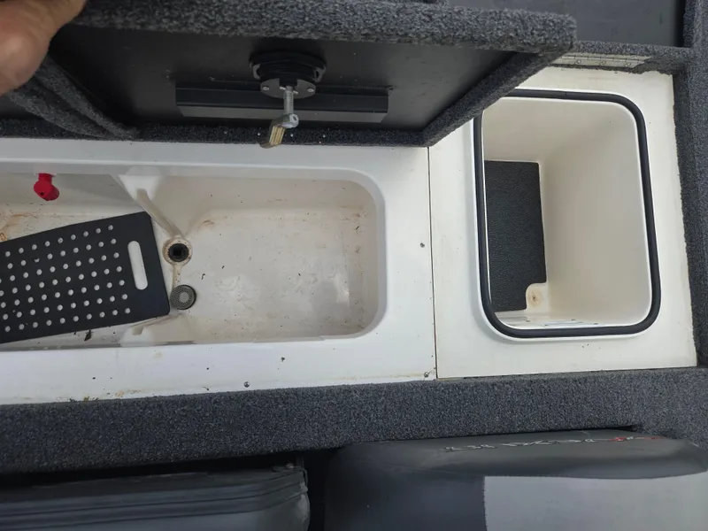 Slide: The Image of 2022 Vexus AVX181 boat storage compartments with open lids, showcasing interior details. - 22