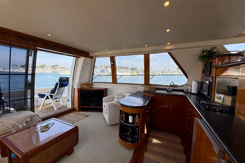 Slide: The Image of Luxurious interior of a 2000 Carver 53 Voyager yacht with scenic water views. - 13