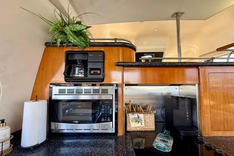 Slide: The Image of Galley kitchen in 2000 Carver 53 Voyager yacht with appliances and decor. - 28