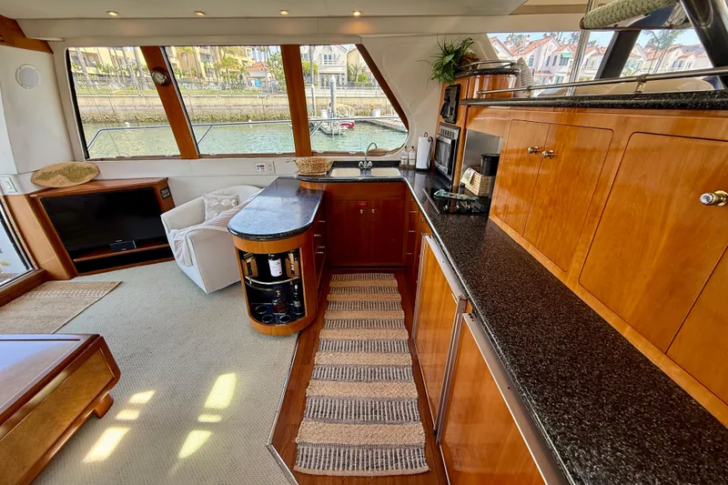 Slide: The Image of Luxurious interior of a 2000 Carver 53 Voyager yacht with elegant wood cabinetry. - 30