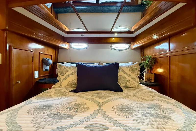 Slide: The Image of Luxurious cabin interior of 2000 Carver 53 Voyager yacht with elegant bedding. - 51