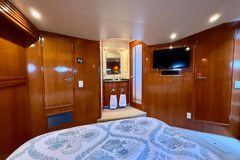 Slide: The Image of Luxurious interior of 2000 Carver 53 Voyager yacht with wood paneling and modern amenities. - 55