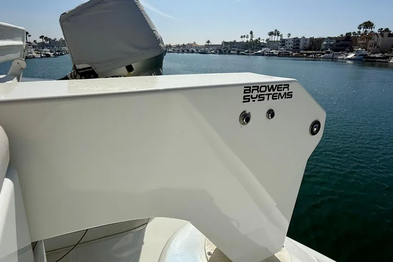 Slide: The Image of 2000 Carver 53 Voyager yacht with Brower Systems equipment, docked in a marina. - 56