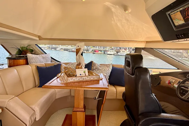 Slide: The Image of Luxurious interior of a 2000 Carver 53 Voyager yacht with elegant seating and decor. - 61