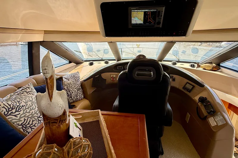 Slide: The Image of Interior helm of 2000 Carver 53 Voyager yacht with decorative accents and navigation equipment. - 65