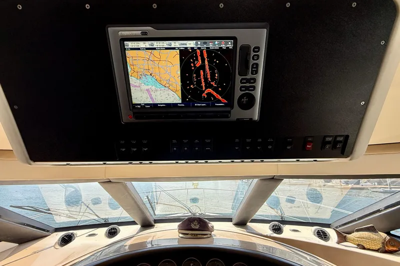 Slide: The Image of Navigation system on 2000 Carver 53 Voyager yacht, displaying nautical charts and radar. - 67