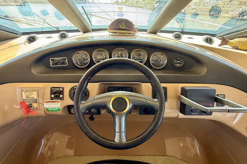 Slide: The Image of Steering wheel and dashboard of a 2000 Carver 53 Voyager yacht. - 68