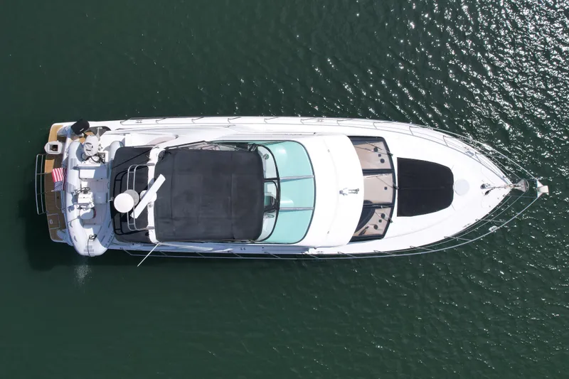 Slide: The Image of Aerial view of 2000 Carver 53 Voyager yacht on calm water. - 7