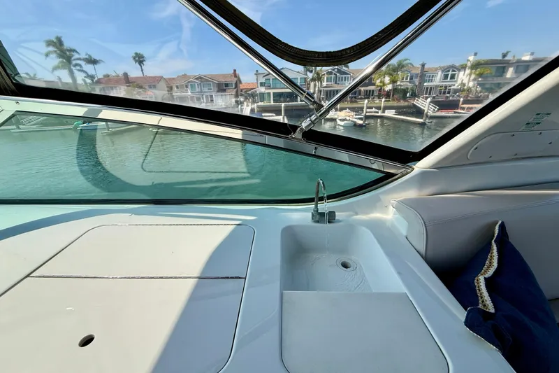 Slide: The Image of Interior view of 2000 Carver 53 Voyager yacht with sink and waterfront homes. - 75