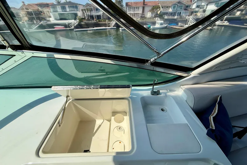 Slide: The Image of Interior view of 2000 Carver 53 Voyager yacht with sink and storage compartment. - 76