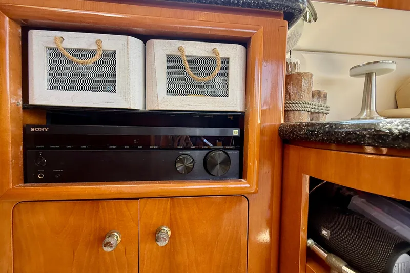 Slide: The Image of Interior of 2000 Carver 53 Voyager with wooden cabinetry and Sony audio system. - 90