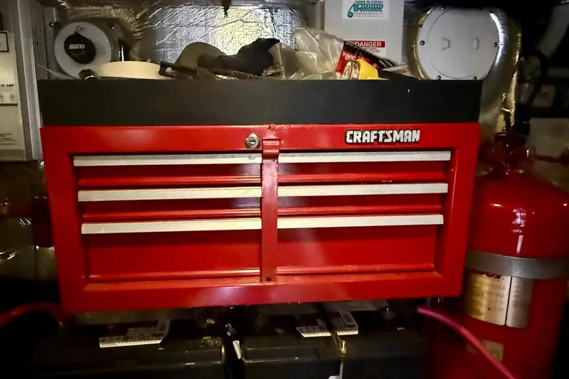 Slide: The Image of Red Craftsman toolbox in a 2000 Carver 53 Voyager engine room. - 97