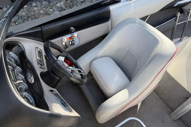 Slide: The Image of 2009 Malibu Response LXi boat interior with steering wheel and dashboard controls. - 11