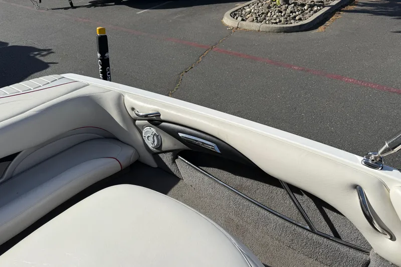 Slide: The Image of 2009 Malibu Response LXi boat interior with white upholstery and speaker detail. - 14