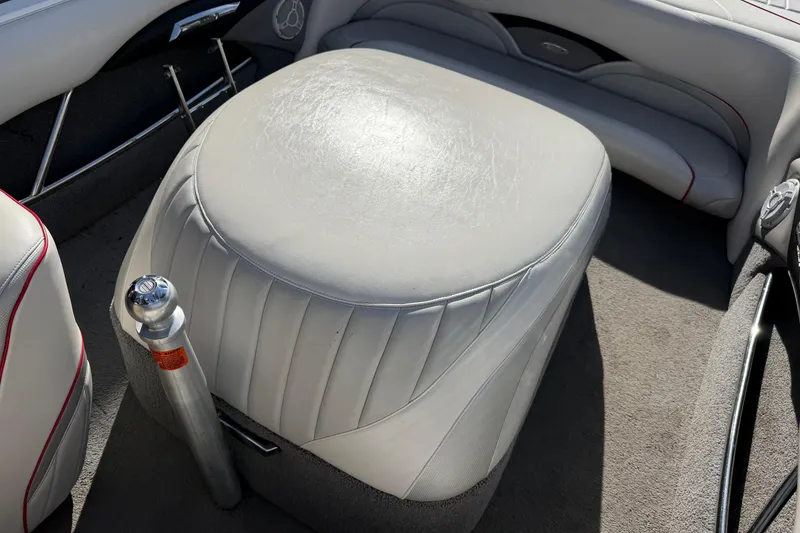 Slide: The Image of 2009 Malibu Response LXi boat interior with white leather seating and metal ski pylon. - 17