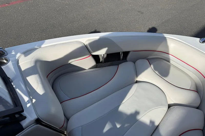 Slide: The Image of 2009 Malibu Response LXi boat interior with white and red-trimmed seating. - 21