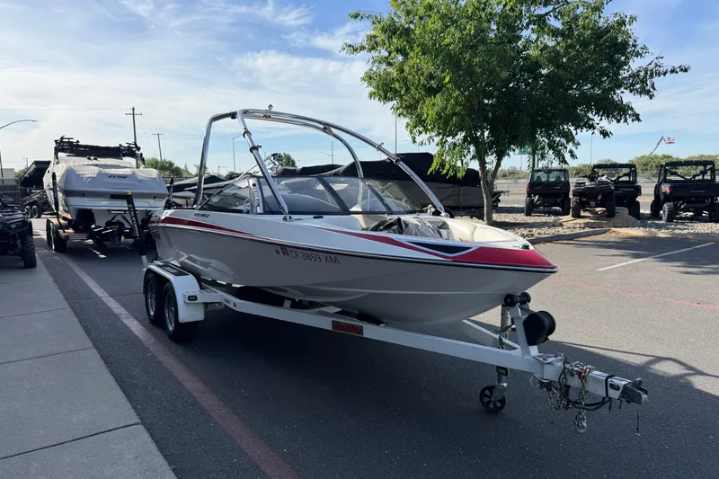 Slide: The Image of 2009 Malibu Response LXi boat on trailer in parking lot, sunny day. - 5