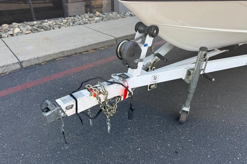 Slide: The Image of Trailer hitch of a 2009 Malibu Response LXi boat on pavement. - 7