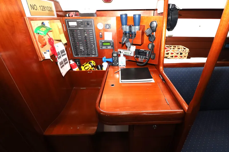 Slide: The Image of Navigation station on 2005 Beneteau Oceanis Clipper 423 yacht with control panel and equipment. - 4