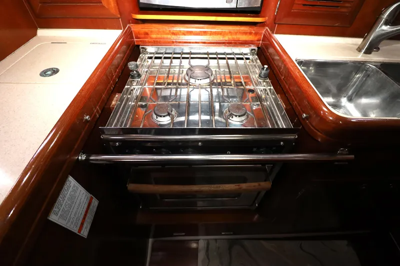 Slide: The Image of Galley kitchen in 2005 Beneteau Oceanis Clipper 423 with stove and sink. - 5