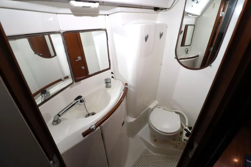 Slide: The Image of Bathroom interior of 2005 Beneteau Oceanis Clipper 423 yacht, featuring sink and toilet. - 8