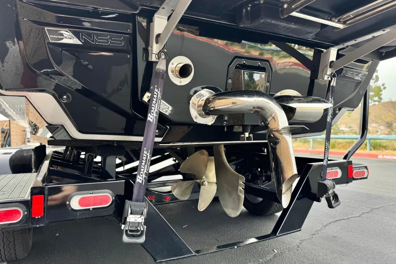 Slide: The Image of 2022 Nautique Super Air Nautique G25 Paragon boat rear view with propeller and exhaust system. - 10