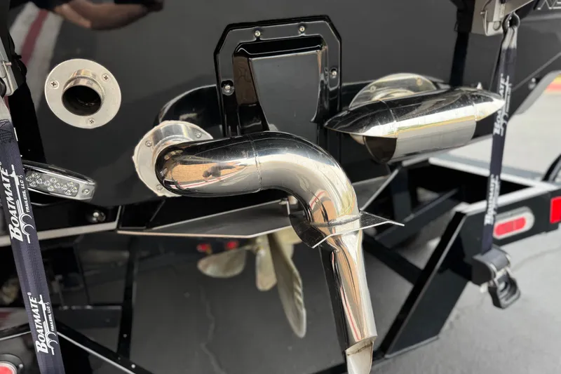 Slide: The Image of 2022 Nautique Super Air Nautique G25 Paragon boat exhaust and propeller detail. - 11