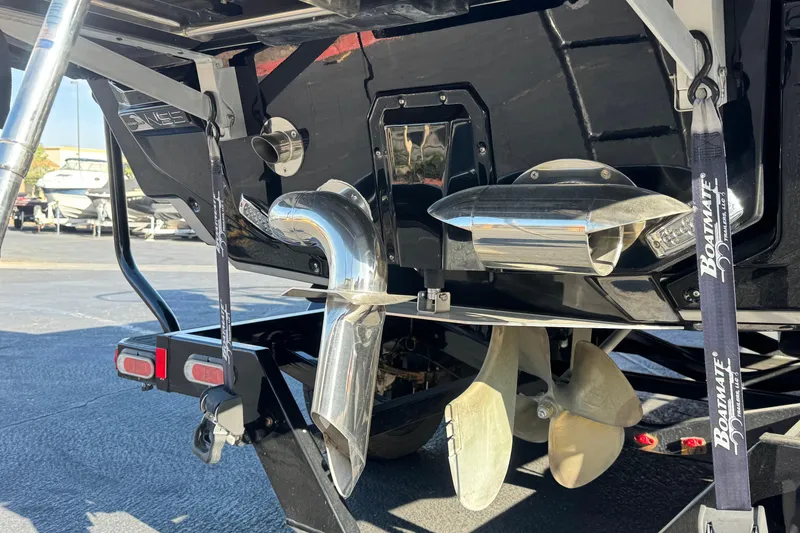 Slide: The Image of 2022 Nautique Super Air Nautique G25 Paragon boat on trailer, parked outdoors. - 2