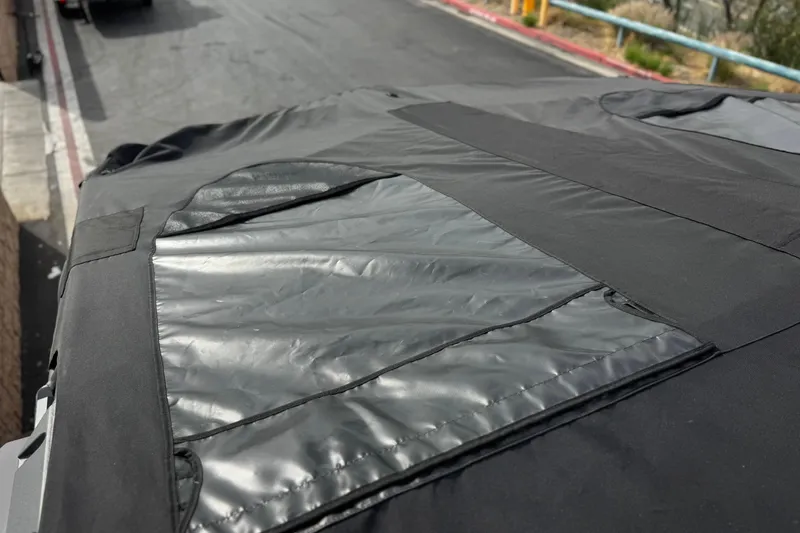 Slide: The Image of Protective cover on 2022 Nautique Super Air Nautique G25 Paragon boat. - 24