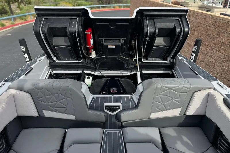 Slide: The Image of 2022 Nautique Super Air Nautique G25 Paragon interior with open engine compartment. - 26