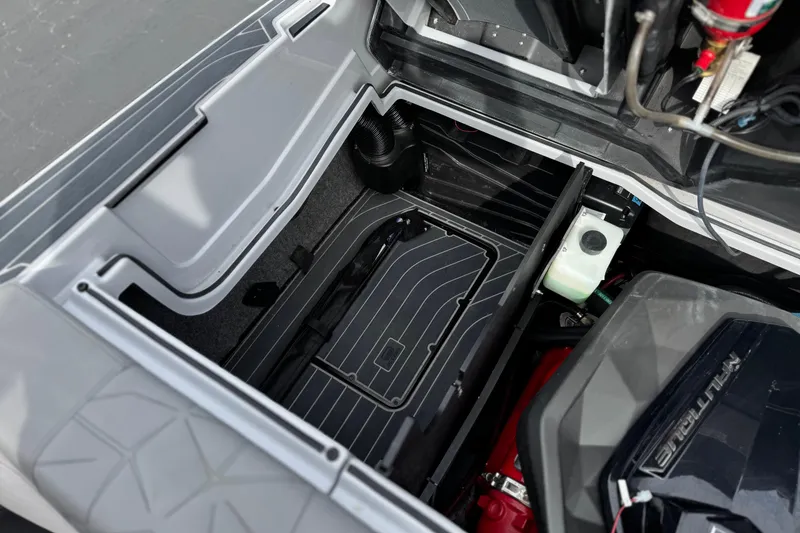 Slide: The Image of 2022 Nautique Super Air Nautique G25 Paragon engine compartment, showcasing storage and components. - 29