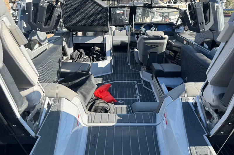 Slide: The Image of 2022 Nautique Super Air Nautique G25 Paragon boat, front view, parked outdoors. - 3