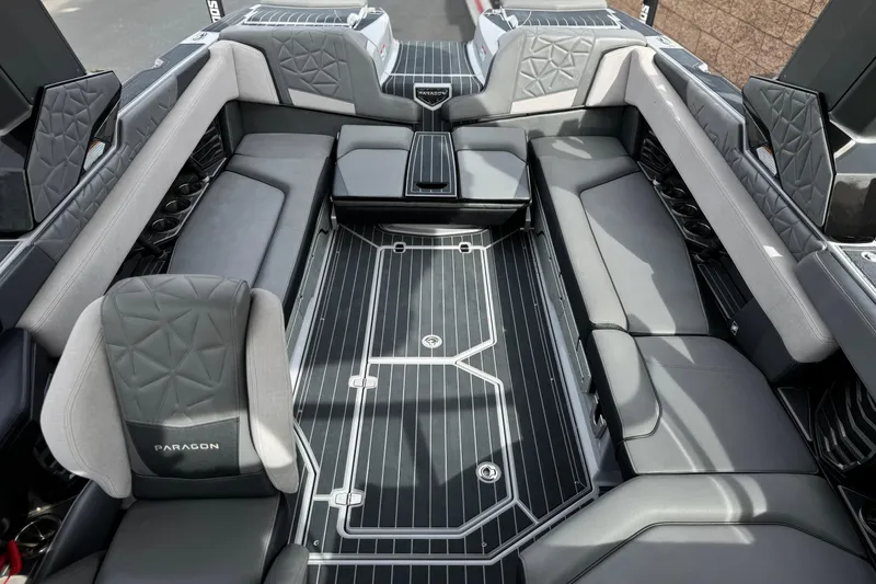 Slide: The Image of Luxurious interior of 2022 Nautique Super Air Nautique G25 Paragon boat, featuring elegant seating. - 31