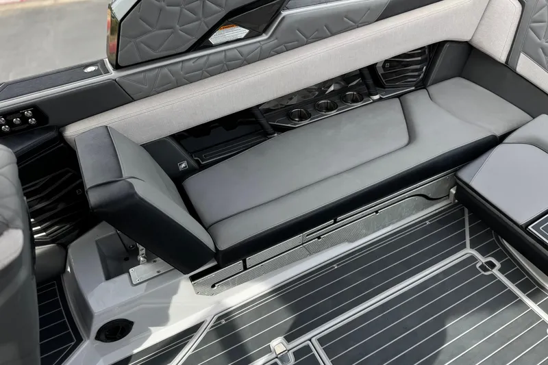 Slide: The Image of 2022 Nautique Super Air Nautique G25 Paragon interior seating with cup holders and sleek design. - 33